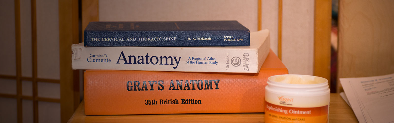 Stack of Anatomy books.