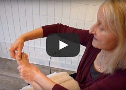 Donna Bajelis works on a client's foot with structural integration techniques.
